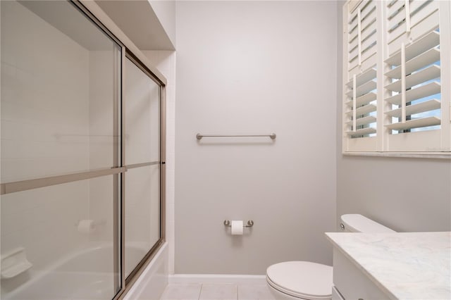 full bathroom featuring vanity, tile patterned floors, toilet, and combined bath / shower with glass door