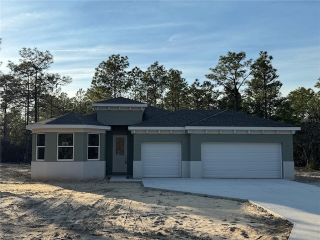 view of front of property with a garage