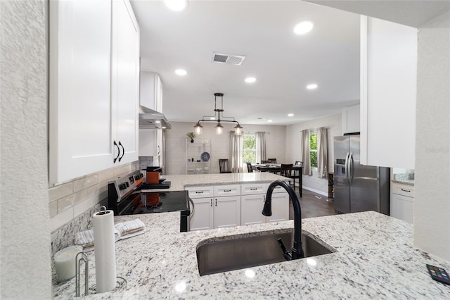 kitchen featuring sink, white cabinets, stainless steel appliances, extractor fan, and light stone countertops