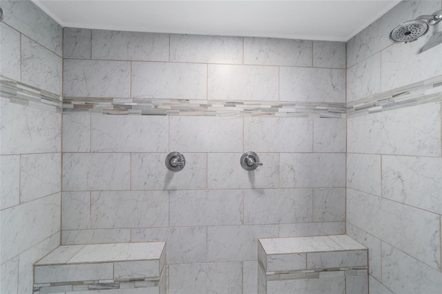 bathroom with tiled shower