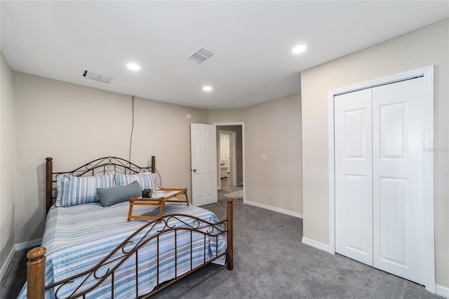 carpeted bedroom featuring a closet