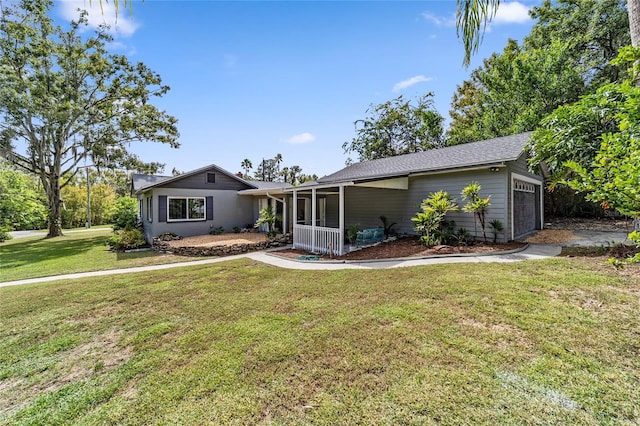 ranch-style home with a garage and a front lawn