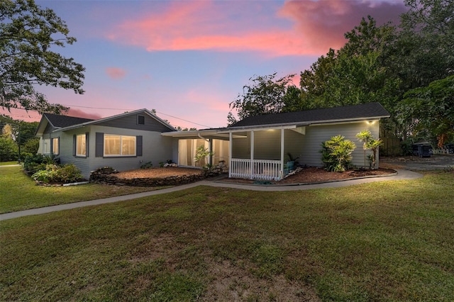 ranch-style house with a lawn