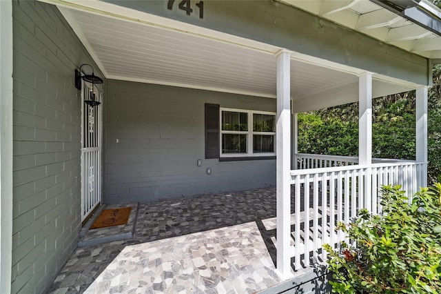 view of patio featuring a porch