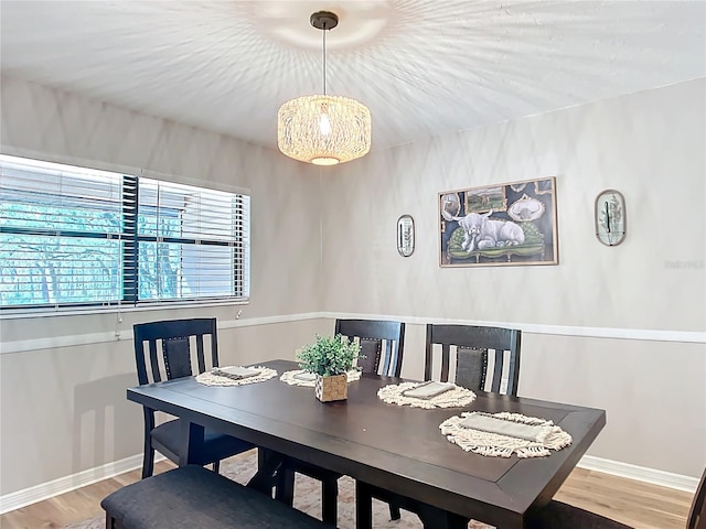 dining area with hardwood / wood-style flooring