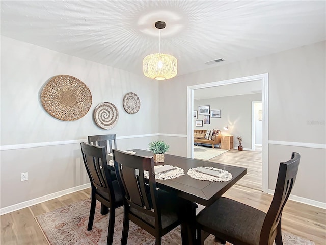 dining space featuring light hardwood / wood-style flooring