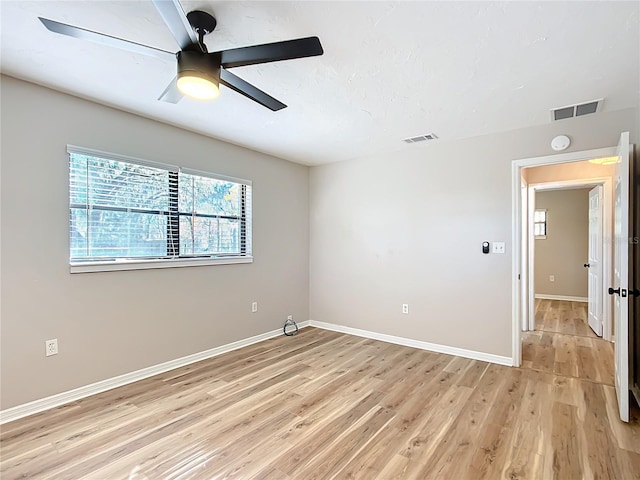 unfurnished room featuring ceiling fan and light hardwood / wood-style floors