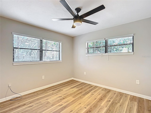 unfurnished room with ceiling fan and light hardwood / wood-style flooring