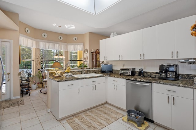 kitchen with white cabinetry and dishwasher