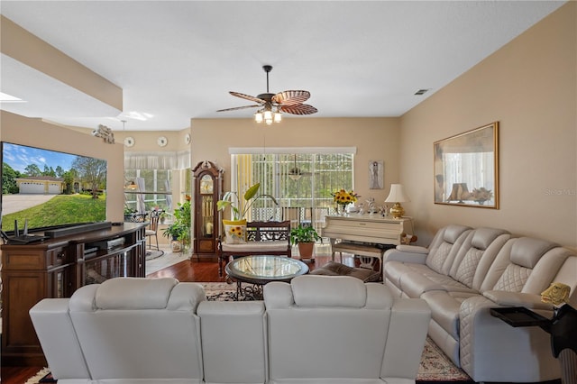 living room featuring wood-type flooring and ceiling fan