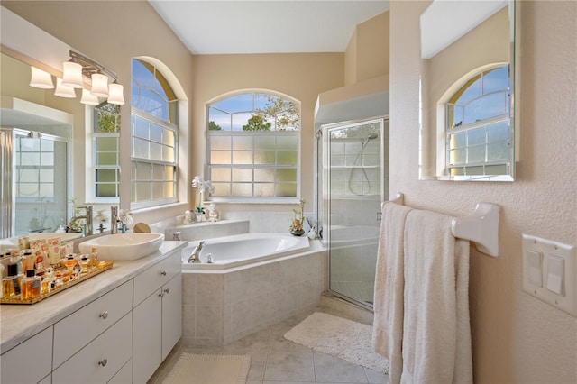 bathroom featuring vanity, tile patterned floors, and shower with separate bathtub