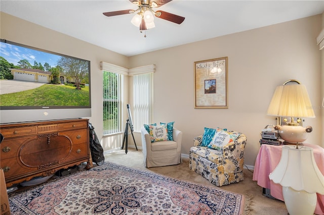 bedroom with light carpet and ceiling fan