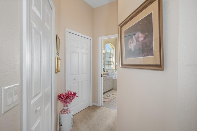 corridor with light colored carpet