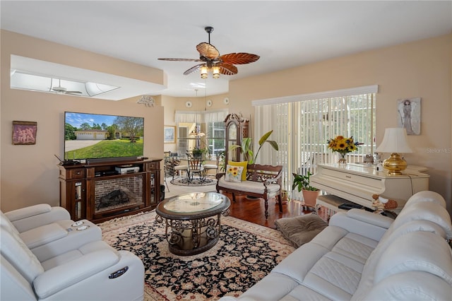 living room featuring ceiling fan and hardwood / wood-style floors