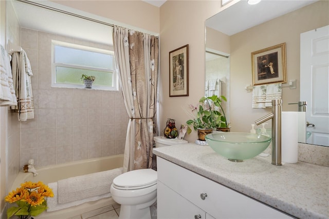 full bathroom with vanity, toilet, tile patterned floors, and shower / tub combo with curtain