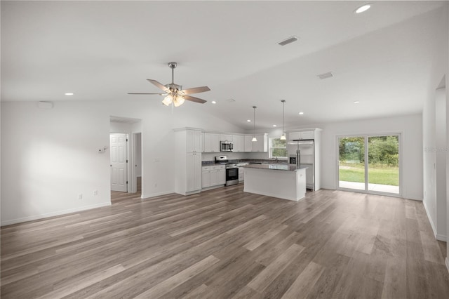 unfurnished living room featuring ceiling fan, high vaulted ceiling, and light wood-type flooring