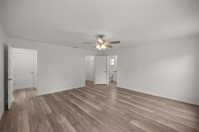 unfurnished room with light hardwood / wood-style flooring and ceiling fan