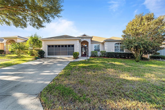 ranch-style home with a garage and a front yard