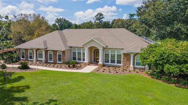 ranch-style home featuring a front yard