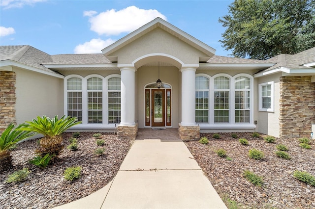 property entrance featuring french doors