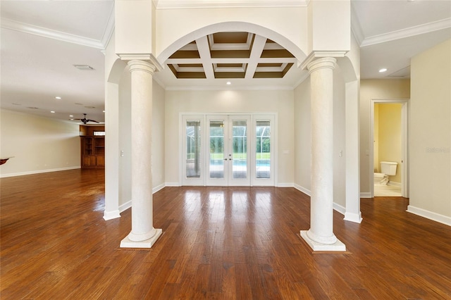 unfurnished living room featuring coffered ceiling, crown molding, french doors, and dark hardwood / wood-style flooring