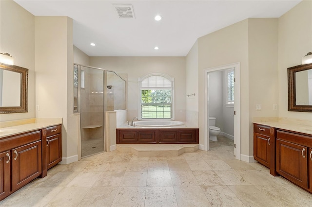 full bathroom featuring plus walk in shower, vanity, and toilet