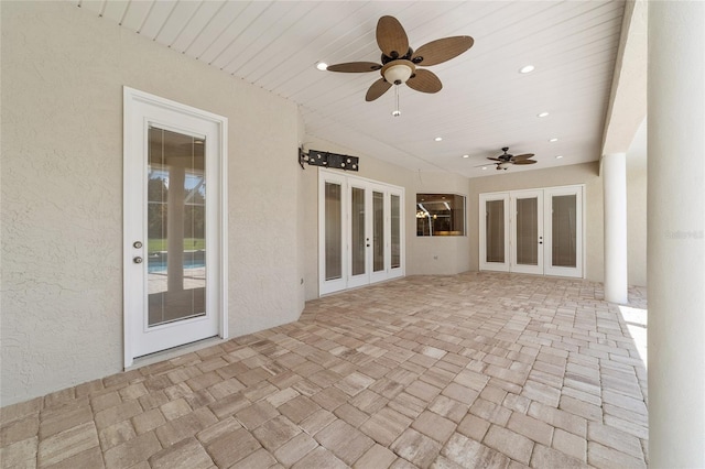 view of patio featuring french doors and ceiling fan