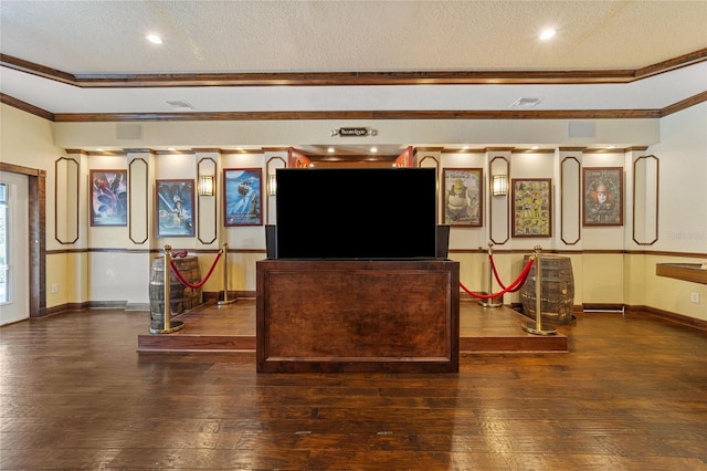 living room with dark hardwood / wood-style floors, crown molding, and a textured ceiling