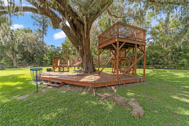 view of yard featuring a playground and a deck