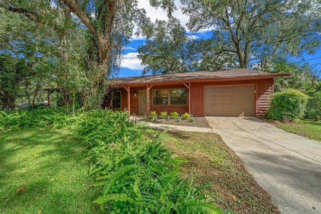 ranch-style home with a front yard and a garage