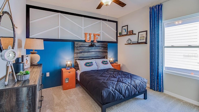 carpeted bedroom with ceiling fan