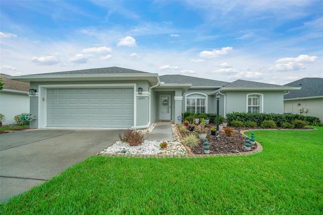 single story home featuring a garage and a front lawn