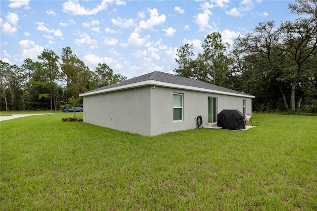 view of side of home featuring a yard