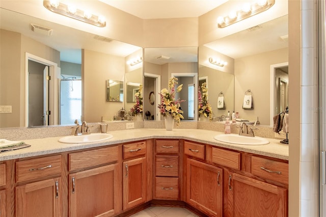 bathroom with vanity and tile patterned floors