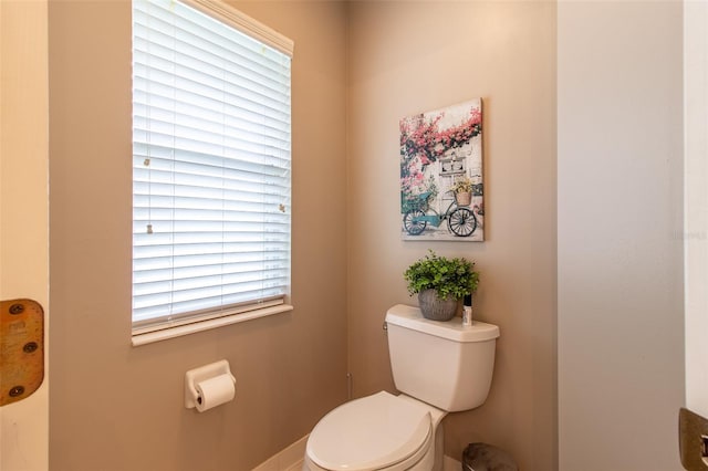 bathroom featuring toilet and a wealth of natural light