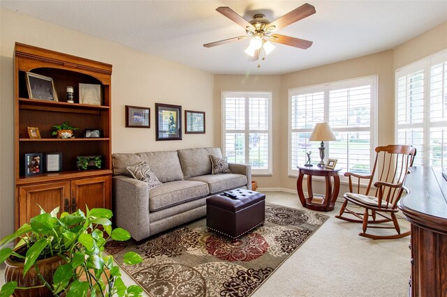 living room featuring ceiling fan and carpet flooring