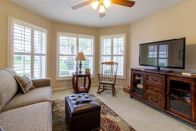 living room featuring ceiling fan and carpet floors