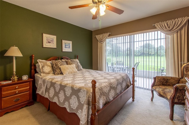 bedroom with light carpet, ceiling fan, and access to outside