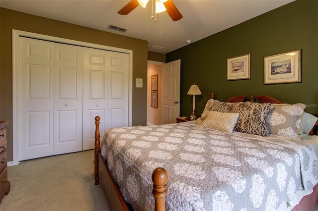 carpeted bedroom with a closet and ceiling fan