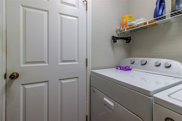 laundry room with washing machine and clothes dryer