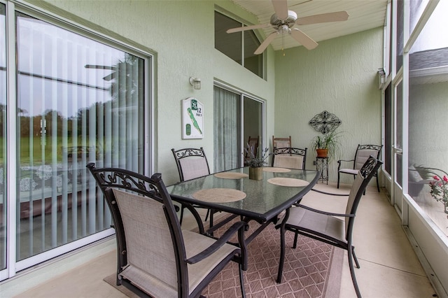 sunroom / solarium with ceiling fan and a healthy amount of sunlight