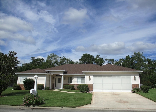 ranch-style home featuring a garage and a front yard