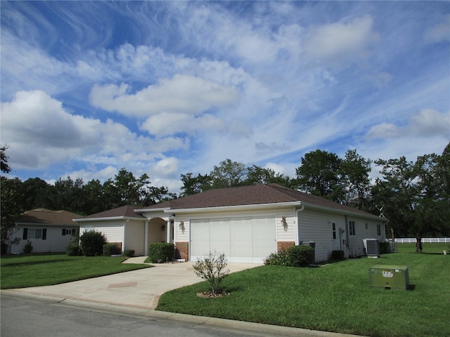 ranch-style house with brick siding, a front yard, and central air condition unit