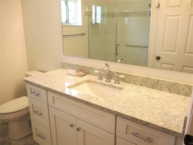 full bathroom with a shower stall, toilet, and vanity