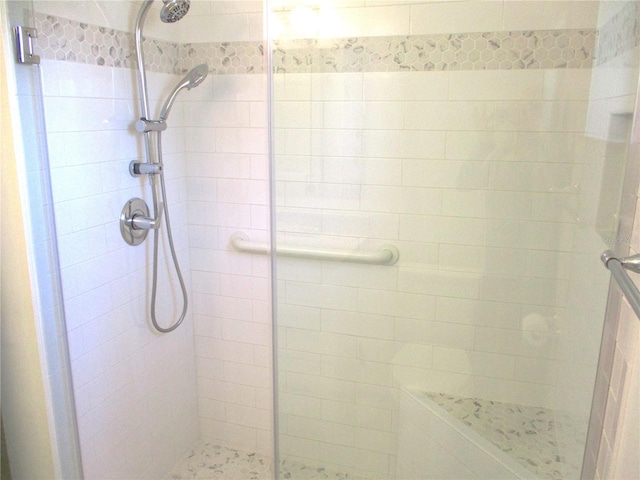 full bathroom featuring a shower stall