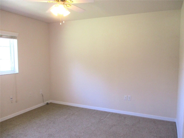 empty room with light colored carpet and baseboards