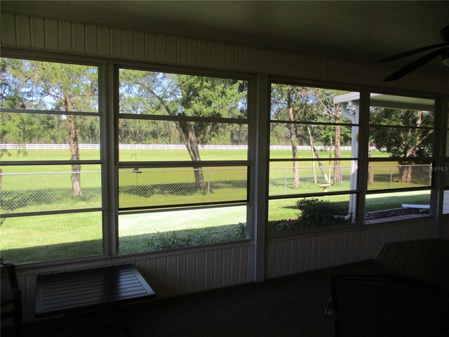 sunroom with a ceiling fan