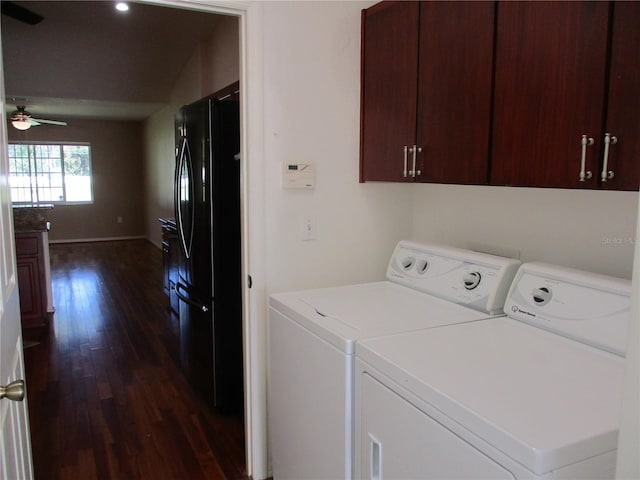 washroom featuring cabinet space, dark wood-type flooring, a ceiling fan, independent washer and dryer, and baseboards