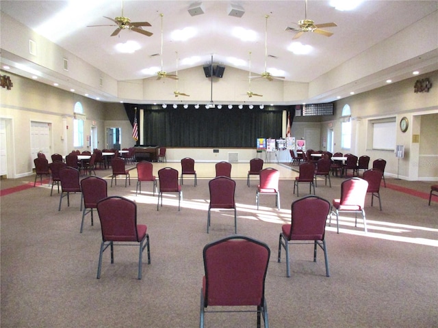 interior space featuring high vaulted ceiling, visible vents, and baseboards