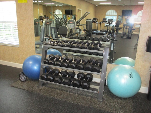 gym featuring baseboards